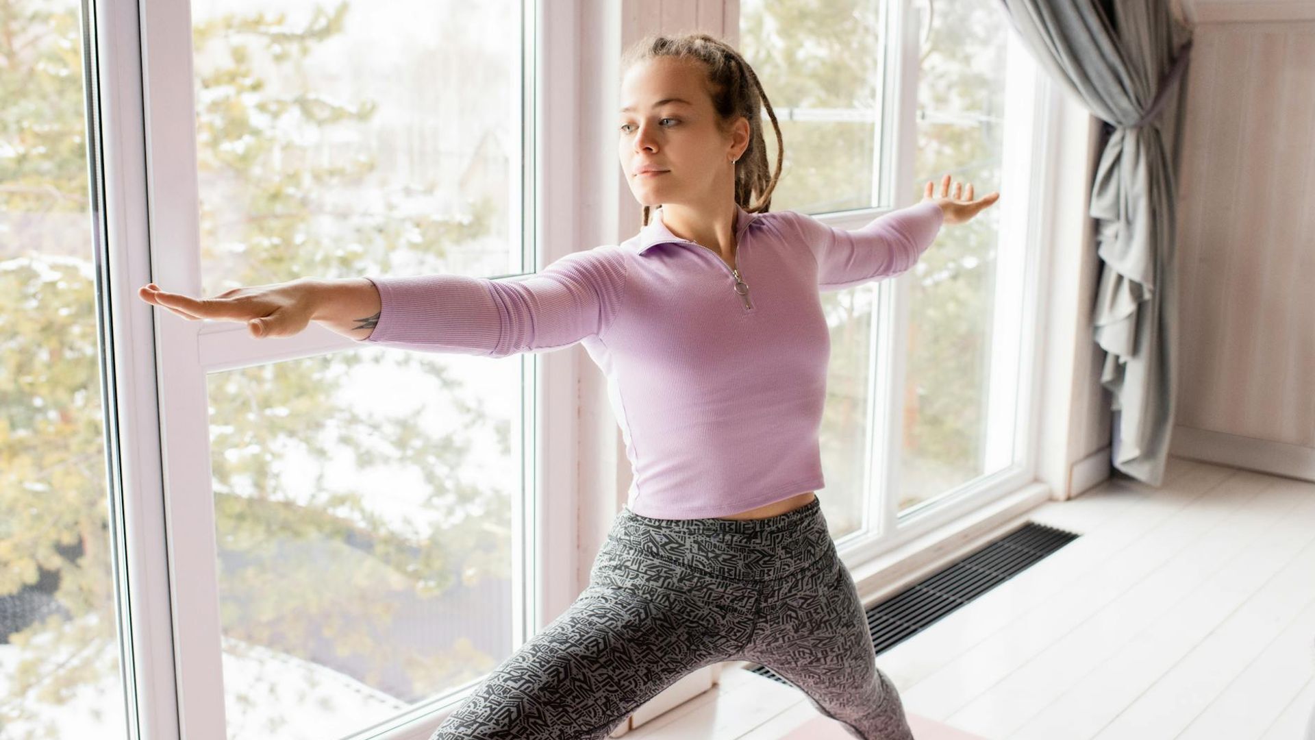 Serene and spacious hall for yoga practice with soft light.